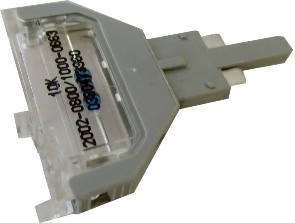 Parameterstecker von Wolf, transparentes Gehäuse mit einer Steckverbindung, dient zur Einstellung von Parametern in elektrischen Anwendungen.